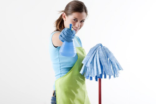 Carpet cleaning technician using safety procedures in a home