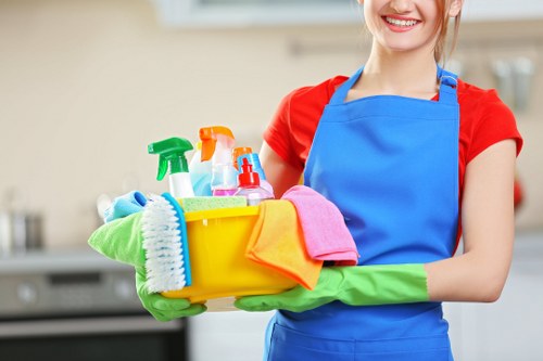 Carpet cleaning technician preparing equipment safely before service
