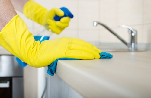 Trained carpet cleaner using PPE during a cleaning job